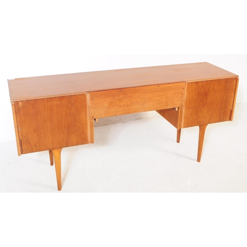 733 - Austinsuite Furniture - A mid 20th century Austinsuite teak veneered dressing table desk. The dresse... 