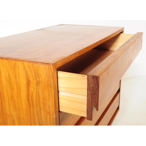 736 - Danish Modern Design - A mid 20th century walnut wood chest of drawers. The chest of rectangular for... 