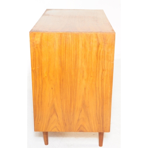 736 - Danish Modern Design - A mid 20th century walnut wood chest of drawers. The chest of rectangular for... 