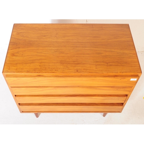 736 - Danish Modern Design - A mid 20th century walnut wood chest of drawers. The chest of rectangular for... 