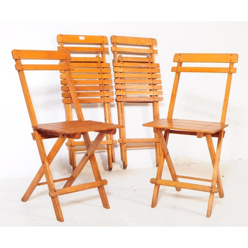 739 - A set of four 20th century folding garden furniture deck chairs. The chairs each of folding metamorp... 