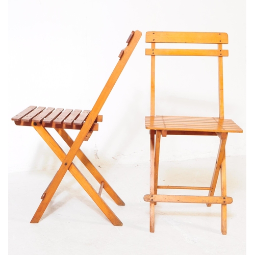 739 - A set of four 20th century folding garden furniture deck chairs. The chairs each of folding metamorp... 