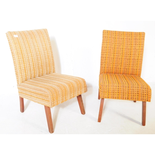 747 - British Modern Design - A pair of mid 20th century easy chairs / lounge chairs. The chairs both upho... 