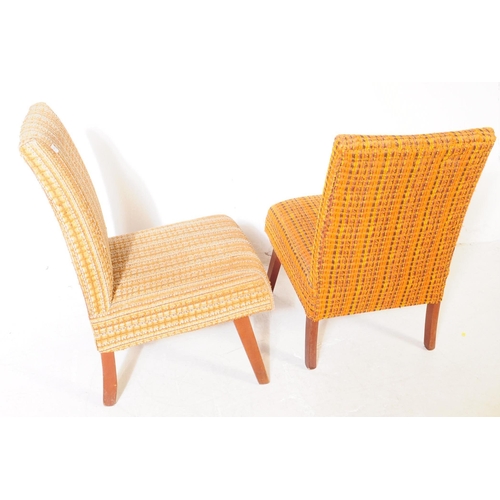 747 - British Modern Design - A pair of mid 20th century easy chairs / lounge chairs. The chairs both upho... 