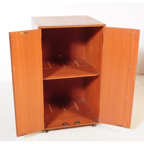 750 - British Modern Design - A mid 20th century walnut veneered record cabinet cupboard. The cupboard of ... 