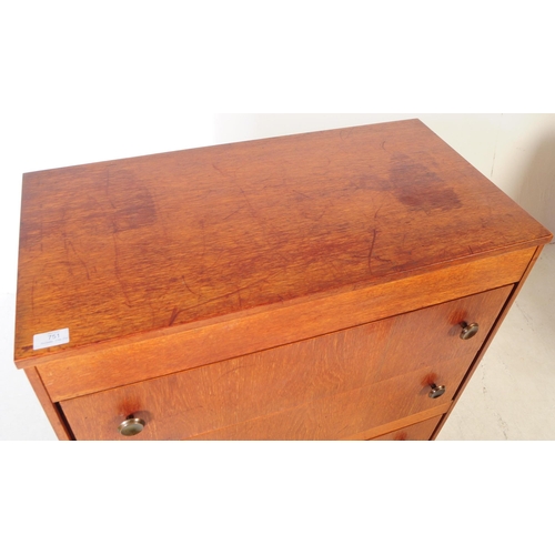 751 - British Modern Design - A mid 20th century teak veneered dressing chest of drawers. The chest of dra... 