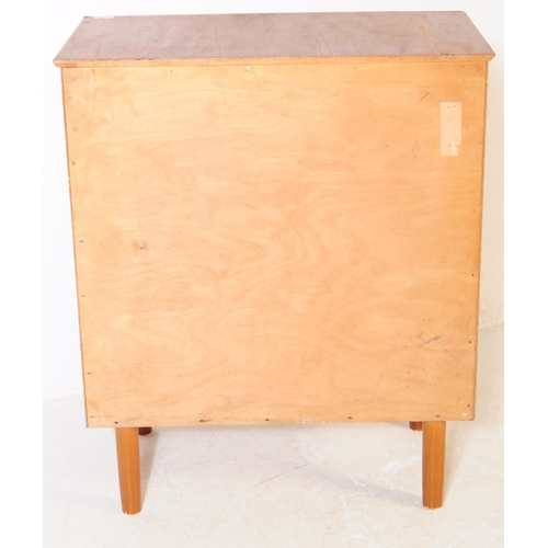 754 - British Modern Design - Mid century teak wood chest of drawers. Rectangular form with a bank of four... 