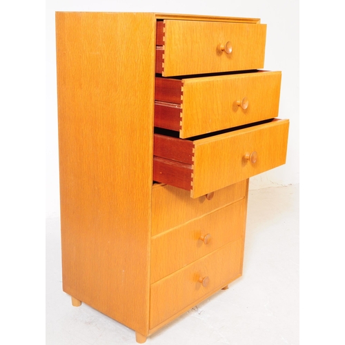 755 - British Modern Design - Mid century oak veneer tall boy chest of drawers. Graduating drawers from la... 