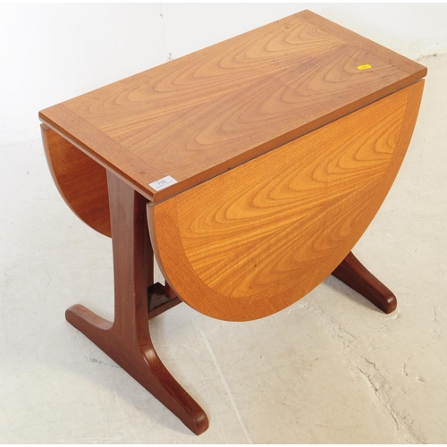 758 - G Plan Furniture - A late 20th century teak space saver drop leaf dining table. Of rectangular form ... 