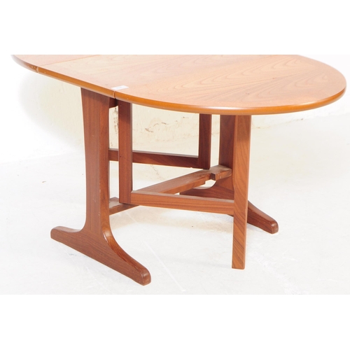 758 - G Plan Furniture - A late 20th century teak space saver drop leaf dining table. Of rectangular form ... 