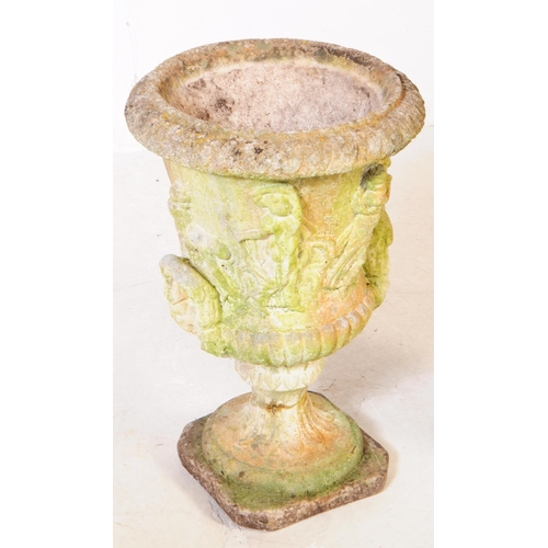 776 - A vintage 20th century garden urn / planter. Together with a seated female garden stoneware statue p... 