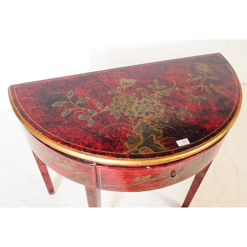 784 - A 20th century chinoiserie style lacquered demi lune console table. The table having hand painted wa... 