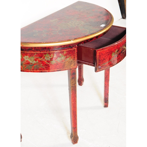 784 - A 20th century chinoiserie style lacquered demi lune console table. The table having hand painted wa... 