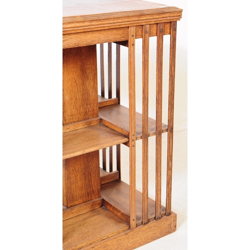 790 - An early 20th century Edwardian mahogany pedestal bookcase. The bookcase featuring slatted sides. Wi... 