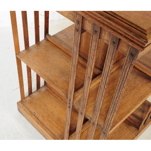 790 - An early 20th century Edwardian mahogany pedestal bookcase. The bookcase featuring slatted sides. Wi... 