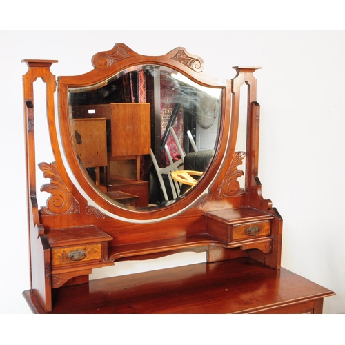 791 - An early 20th century Edwardian walnut bedroom suite. The suite comprising a dressing chest of drawe... 