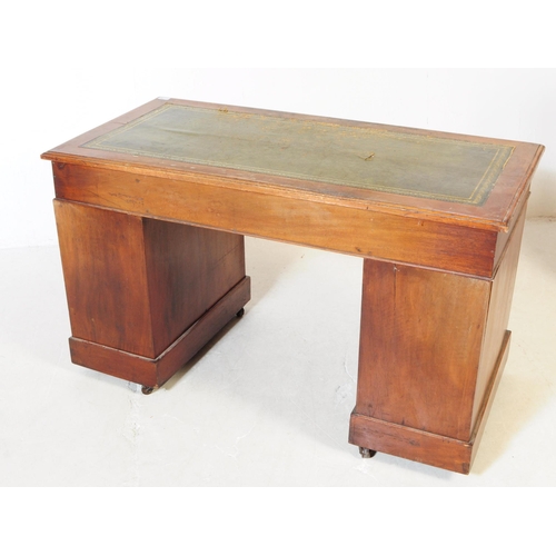 792 - A 19th century Victorian mahogany twin pedestal office writing desk. The desk raised on twin pedesta... 