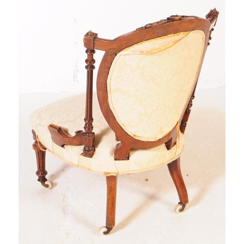 793 - A 19th century Victorian Aesthetic movement nursing chair. The chair having turned legs terminating ... 