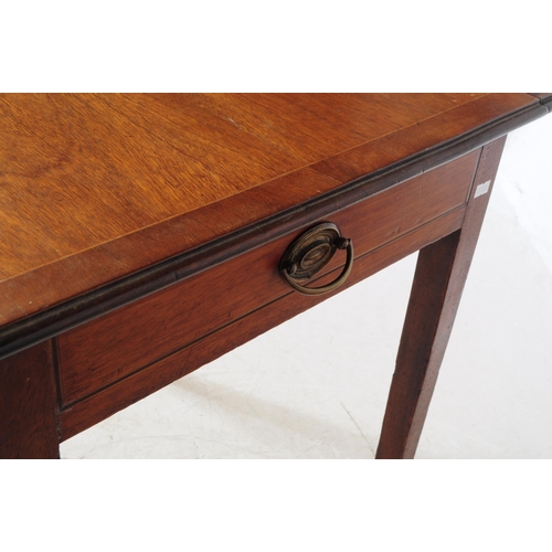 801 - A 19th century George III mahogany pembroke table. Raised on square tapering legs terminating in cas... 