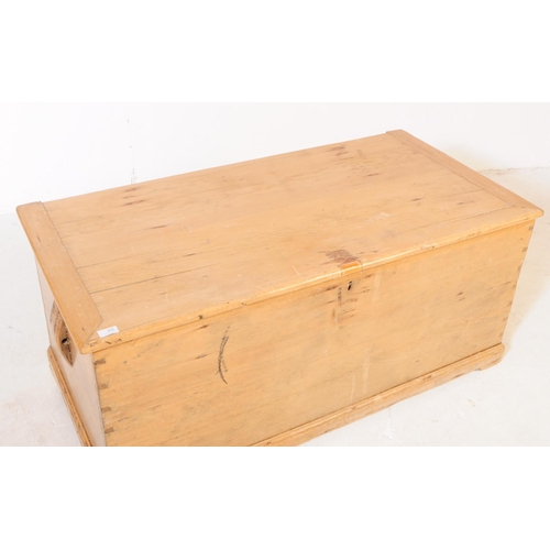 806 - A 19th century Victorian pine blanket box. The chest having sloped handles to either side and doveta... 