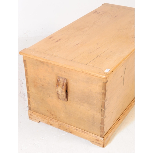 806 - A 19th century Victorian pine blanket box. The chest having sloped handles to either side and doveta... 