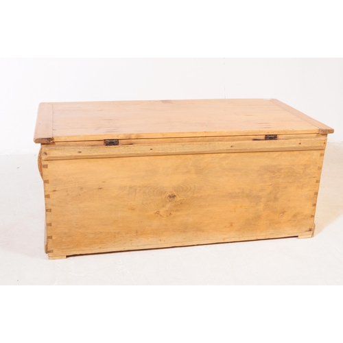 806 - A 19th century Victorian pine blanket box. The chest having sloped handles to either side and doveta... 