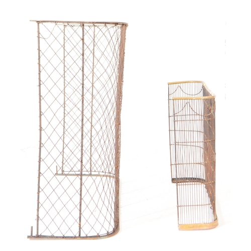 817 - Two early 20th century fire side screens / protectors. Of curved form with wire mesh front and suppo... 