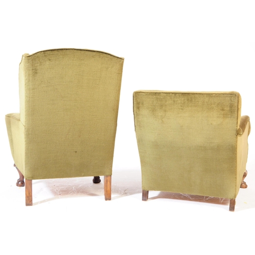 826 - Two vintage 20th century green upholstered his and hers fireside lounge armchairs. With wing back ar... 