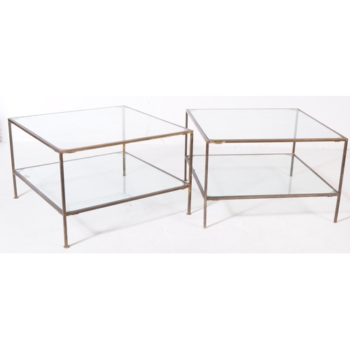 828 - A vintage 20th century brass and glass coffee / occasional table. Of square form with two tier glass... 