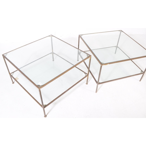 828 - A vintage 20th century brass and glass coffee / occasional table. Of square form with two tier glass... 