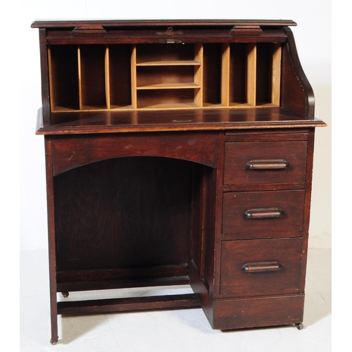 844 - An early 20th century mahogany roll top single pedestal writing desk. The desk raised on a single pe... 