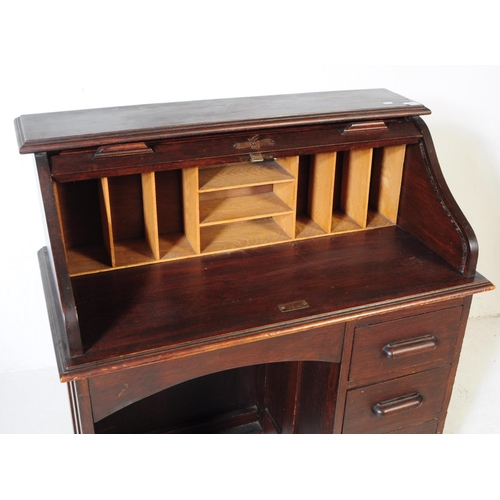 844 - An early 20th century mahogany roll top single pedestal writing desk. The desk raised on a single pe... 