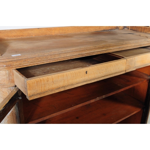 851 - A 19th century Victorian pine pier cupboard / library bookcase. The cabinet having two glazed doors ... 