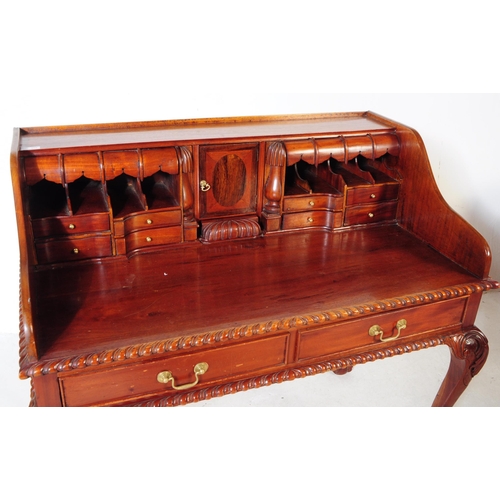 852 - A Chippendale revival mahogany Carlton House manner desk. The desk raised on long carved cabriole le... 