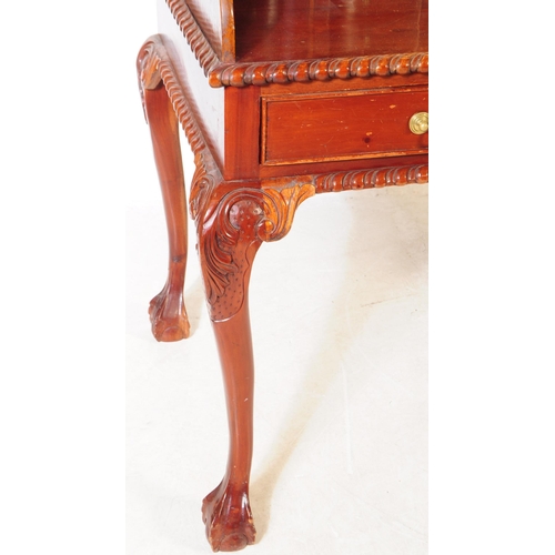 852 - A Chippendale revival mahogany Carlton House manner desk. The desk raised on long carved cabriole le... 