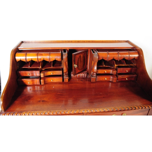 852 - A Chippendale revival mahogany Carlton House manner desk. The desk raised on long carved cabriole le... 