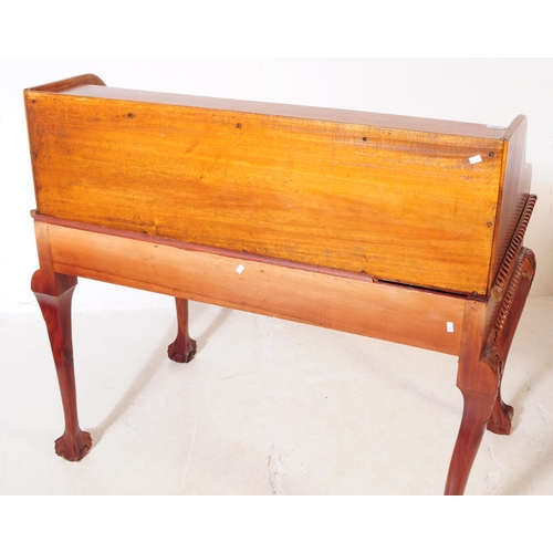 852 - A Chippendale revival mahogany Carlton House manner desk. The desk raised on long carved cabriole le... 