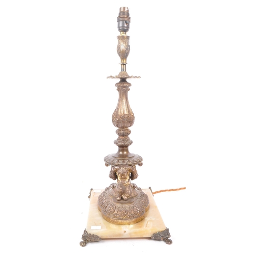 856 - A 19th Century French bronze lamp candlestick having floral and foliate design to sconce and column ... 