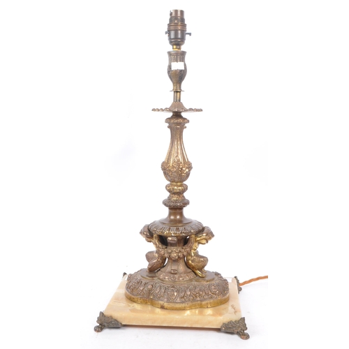 856 - A 19th Century French bronze lamp candlestick having floral and foliate design to sconce and column ... 