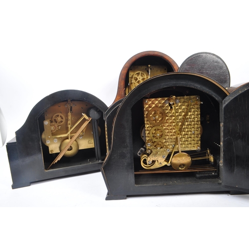 857 - A collection of four Art Deco Napoleon shaped mantel clocks all with Westminster chime movement, hav... 