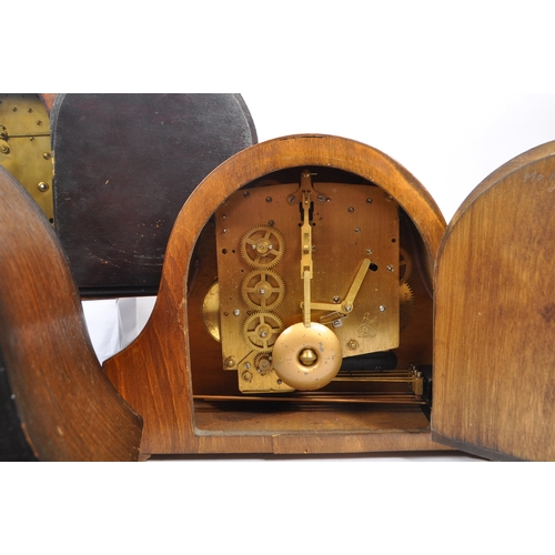 857 - A collection of four Art Deco Napoleon shaped mantel clocks all with Westminster chime movement, hav... 