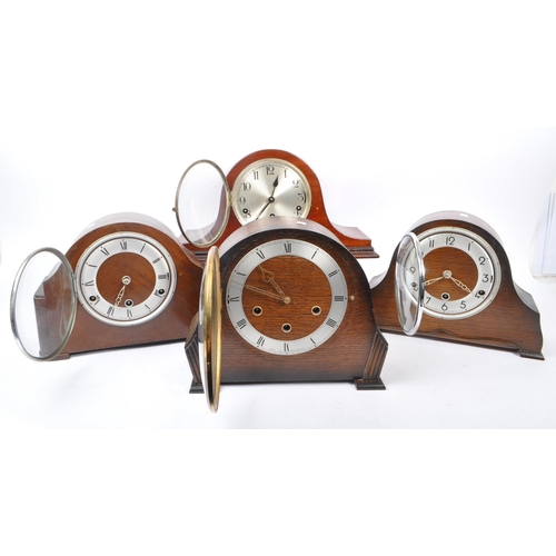 857 - A collection of four Art Deco Napoleon shaped mantel clocks all with Westminster chime movement, hav... 