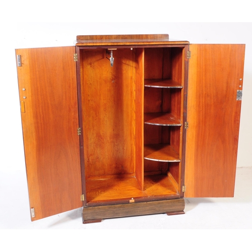 864 - An early 20th Century Art Deco circa 1920s walnut veneer bachelors wardrobe cupboard. The wardrobe r... 