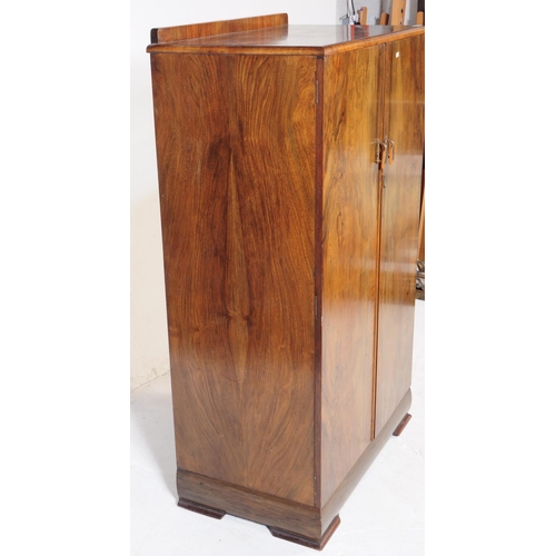 864 - An early 20th Century Art Deco circa 1920s walnut veneer bachelors wardrobe cupboard. The wardrobe r... 