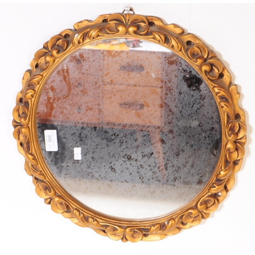 866 - Two Italian rococo manner giltwood and gesso framed wall mirrors. Each mirror featuring a carved roc... 