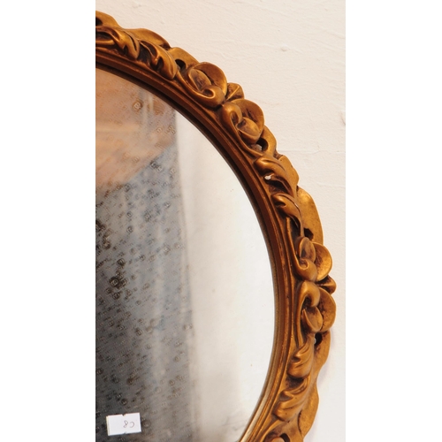 866 - Two Italian rococo manner giltwood and gesso framed wall mirrors. Each mirror featuring a carved roc... 