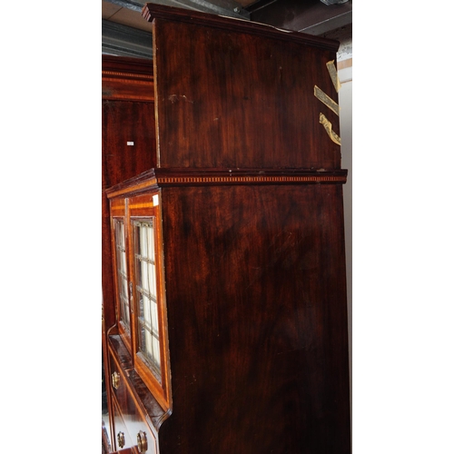 874 - An Edwardian circa 1900s inlaid compactum wardrobe armoire. Of rectangular form with slot in gallery... 