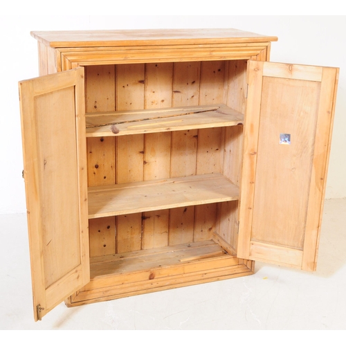 876 - A Victorian 19th century pitch pine school cupboard. Of rectangular form with flared top, twin woode... 