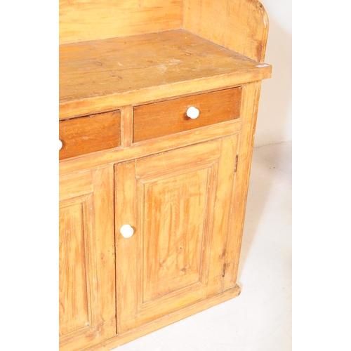 877 - A 19th century Victorian pine sideboard dresser. The sideboard raised on a plinth base below two cup... 