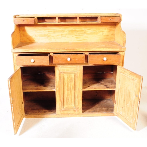 877 - A 19th century Victorian pine sideboard dresser. The sideboard raised on a plinth base below two cup... 